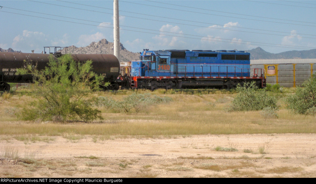 FXE SD40-2 leading a train Long hood forward